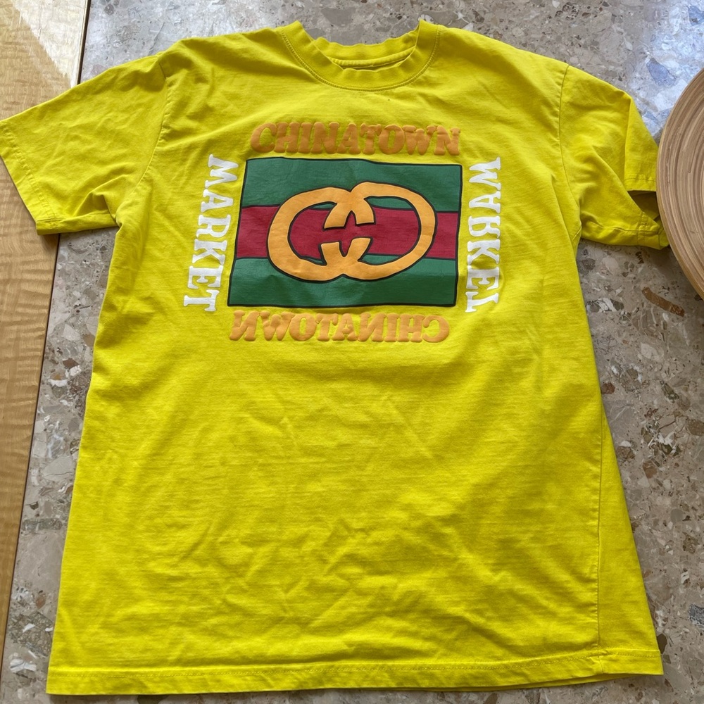 Chinatown market Tee.  Fits more like a large